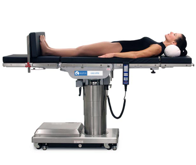 Model reclined on Skytron 6302 Elite surgical table white background