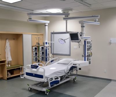 ICU with patient bed with Skytron Booms and Spectra exam light